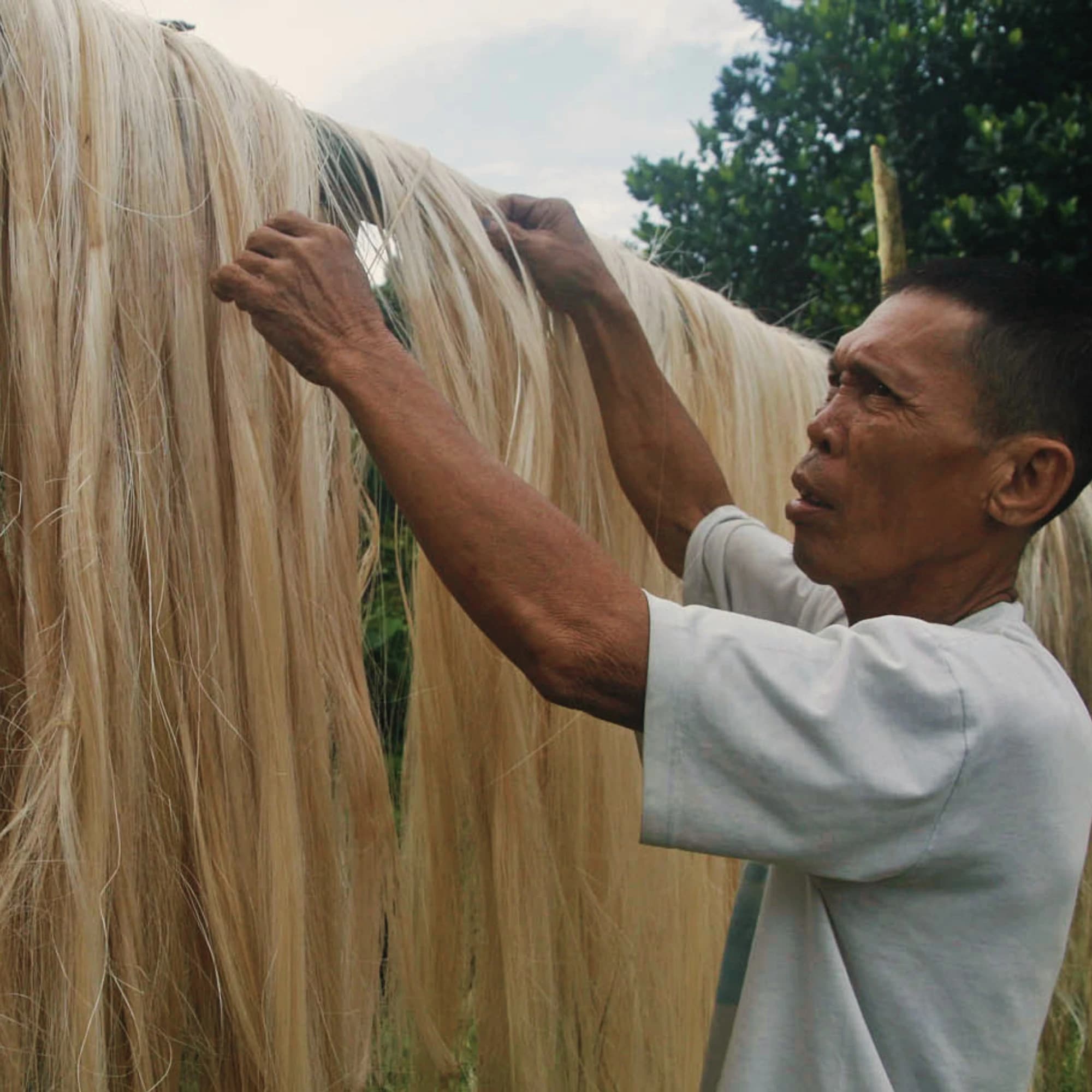 Artisan working with natural fibers